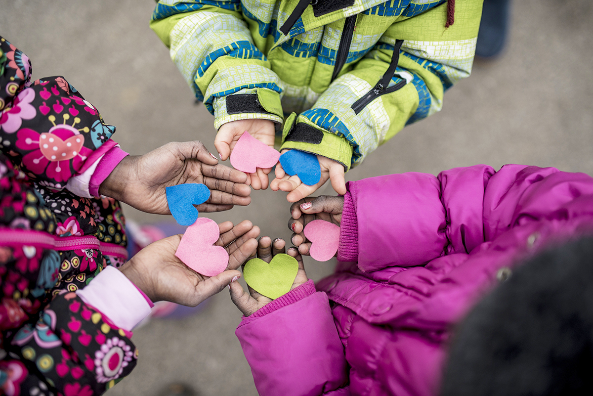 Student hands with Hearts